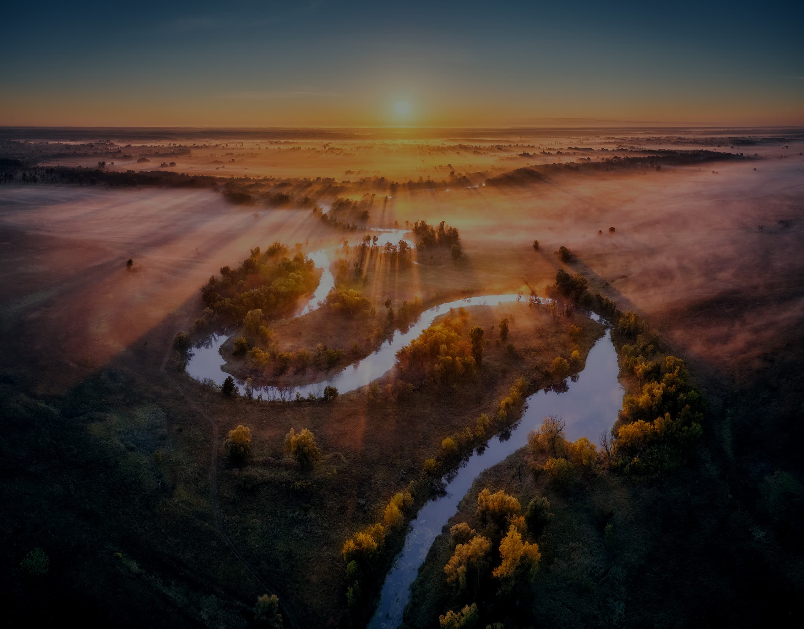 aerial-view-of-curving-river-in-pink-low-clouds-at-2026-01-06-00-55-20-utc.jpg